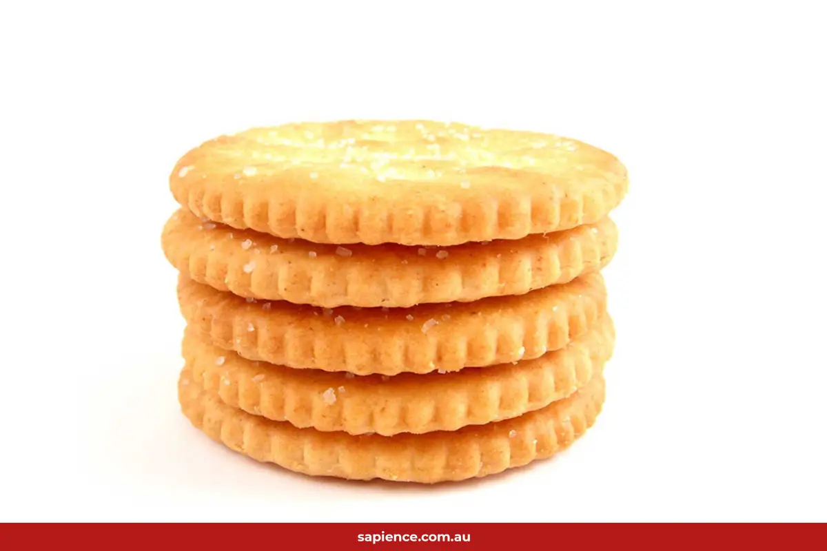 stack of processes salt crackers, high in processes sugar