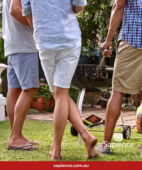 friends standing at a BBQ