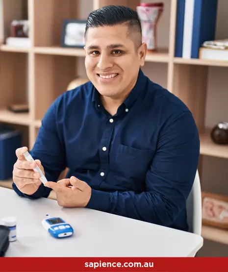 young man testing his blood sugars to manage his diabetes