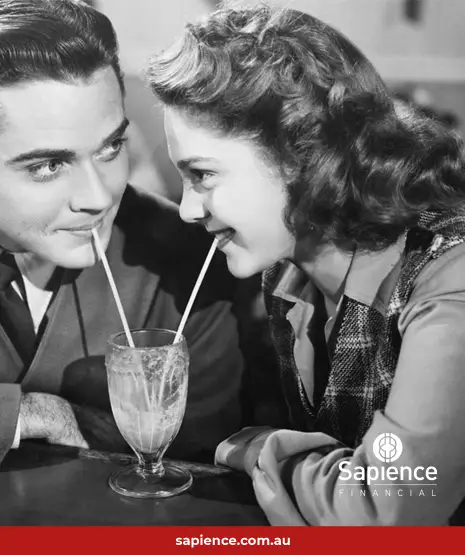 black and white of photo couple sharing single milkshake with straws
