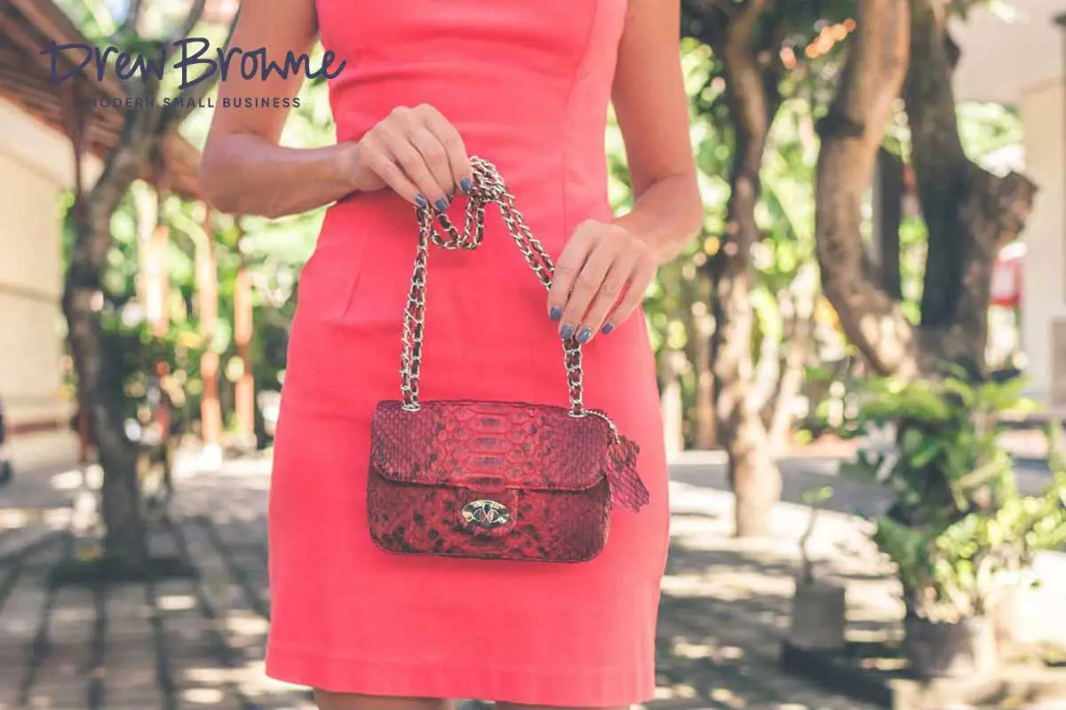 a shapely lady with an expensive red purse
